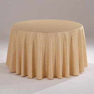 A luxurious champagne gold round hotel tablecloth with a refined geometric woven pattern draped elegantly over a banquet table