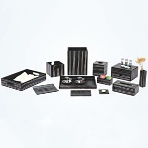 Galaxy Hospitality luxury hotel room accessory set in matte black faux leather featuring thin decorative silver vertical zebra stripes