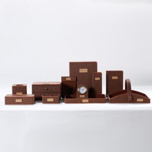 Galaxy Hospitality luxury guest room accessory set in deep burgundy red faux leather with clean stitching and white accent borders