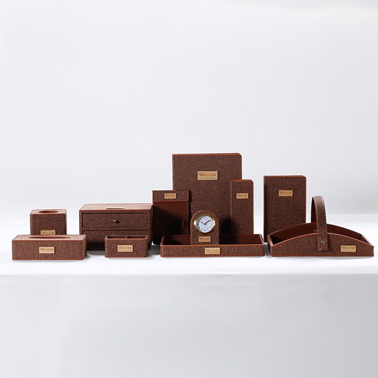 Galaxy Hospitality luxury guest room accessory set in deep burgundy red faux leather with clean stitching and white accent borders