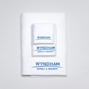 Galaxy Hospitality white luxury hotel towels with premium platinum silver satin wide borders and custom embroidered brand logo