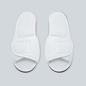 Galaxy Hospitality luxury white open-toe waffle weave disposable hotel slippers with an adjustable velcro flap