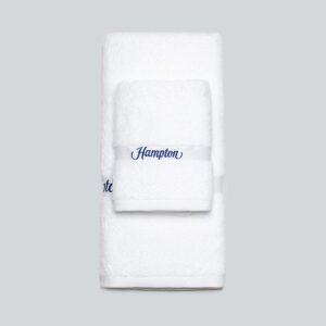 Galaxy Hospitality white luxury hotel bath towels featuring a classic textured dobby woven border near the hem