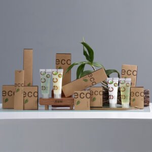 ECO SWISS hotel amenities with brown kraft paper packaging, green leaf design, and matching translucent squeeze tubes