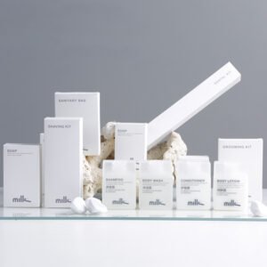 mille brand luxury hotel guest amenities and disposable toiletries with minimalist white paper packaging and frosted square bottles