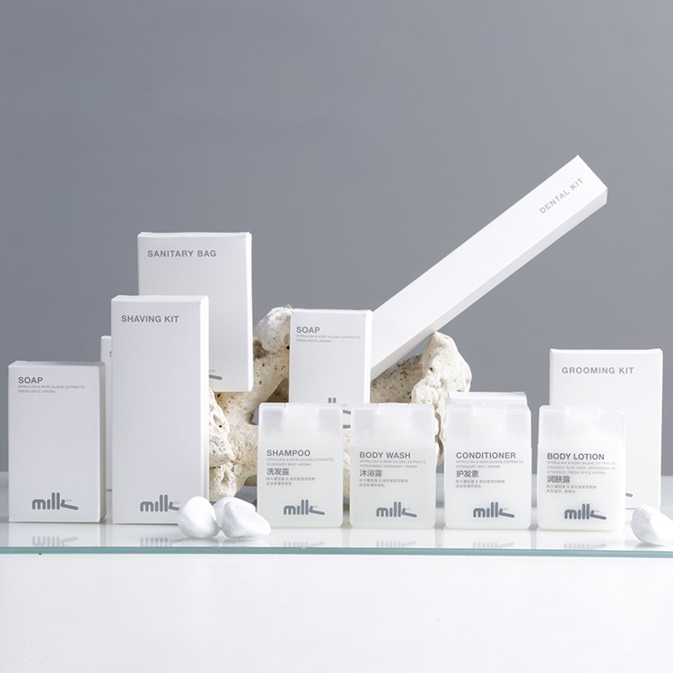 mille brand luxury hotel guest amenities and disposable toiletries with minimalist white paper packaging and frosted square bottles