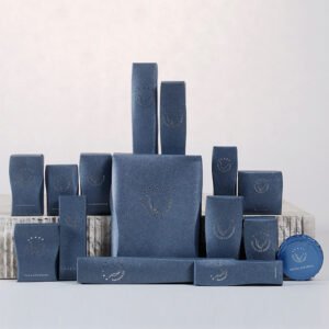 Galaxy Hospitality luxury textured sapphire blue custom hotel amenity gift sets with elegant curved side panels and custom silver printed branding