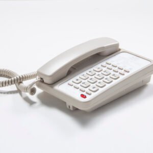Classic beige hotel guestroom landline telephone with customizable speed dial panel and message waiting light