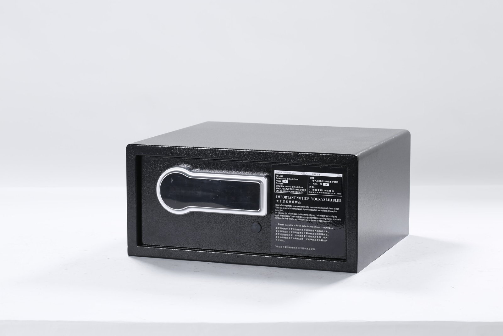 Black hotel in-room electronic safe box with a digital keypad and bilingual instruction panel