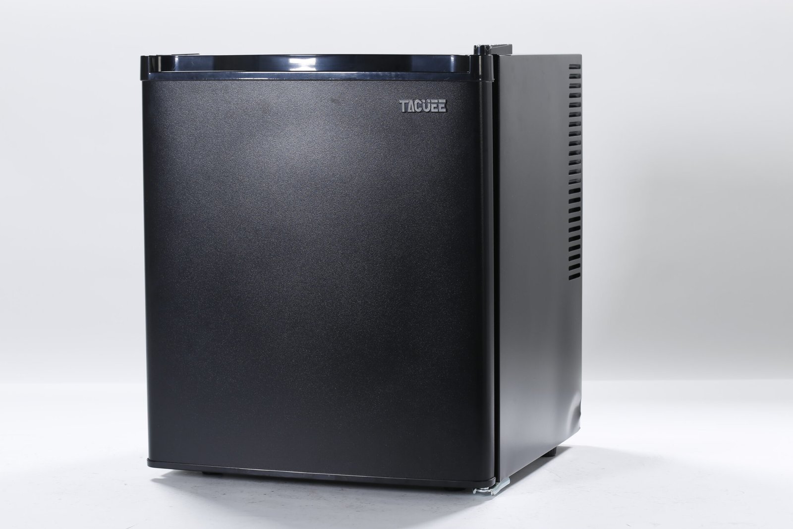 Sleek matte black silent hotel minibar fridge featuring a compact solid door design