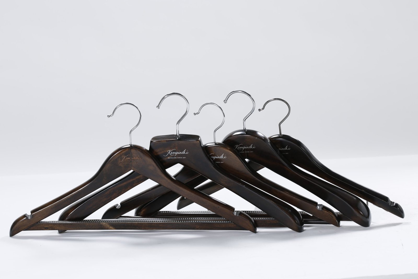 Luxury custom branded dark brown wooden hotel hangers with polished silver steel hooks