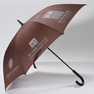Custom printed black hotel concierge umbrella featuring a comfortable curved handle and white resort logo