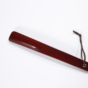 Premium dark brown wooden hotel room shoe horn with a durable leather hanging loop