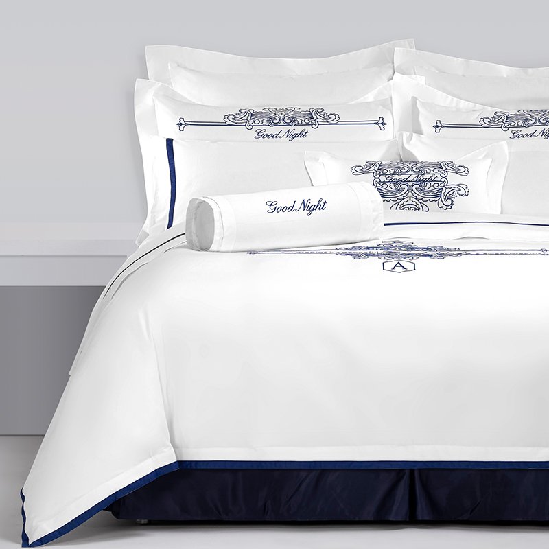 Galaxy Hospitality luxury white bedding set with royal blue court scroll embroidery and sleek satin applique border