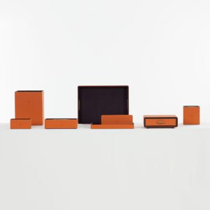 Galaxy Hospitality customizable luxury guest room organizer set in vibrant Hermes orange leatherette with debossed logos and brass accents
