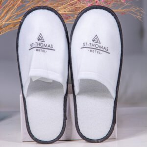 Galaxy Hospitality luxury white closed-toe disposable hotel slippers with black custom logo printing for St-Thomas Hotel