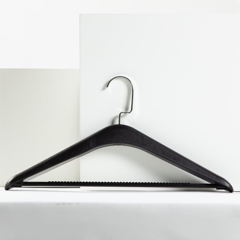 Premium lightweight natural wood hotel clothes hangers with anti-slip shoulder notches and a smooth pants bar