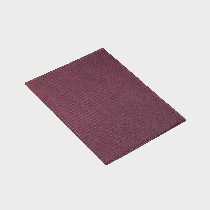 Burgundy wine red wholesale polyester pearl dot jacquard placemats showing beaded polka dot motif and satin woven finish