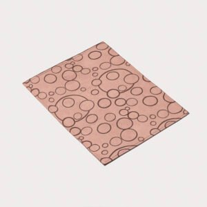 Pink rose wholesale polyester bubble jacquard placemats showing floating ring circle pattern and satin woven finish