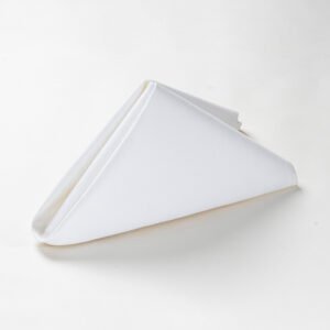 Folded white triangle wholesale white cotton jacquard patterned napkins showing diamond lattice, floral damask, and marble vein textures