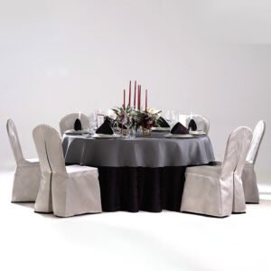 Burgundy jacquard tablecloth set styled with charcoal grey overlay and white chair covers for luxury hotel banquets