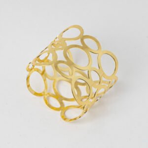 Polished gold cutout oval napkin ring featuring an openwork geometric mesh pattern on a white background