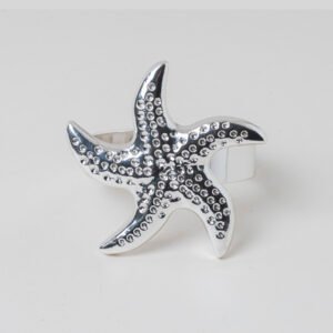 Polished silver starfish napkin ring featuring a 3D textured sea star design on a clean white background