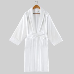White cut pile velour hotel bathrobe with shawl collar and waist tie belt