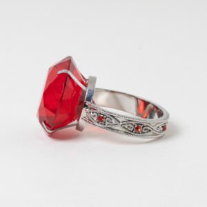 Vintage silver napkin ring shaped like a giant red gemstone ring with filigree band and accent crystals